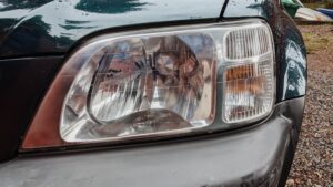 The left headlight that has been detailed and had restoration done to now be crystal clear.